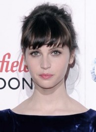 http://www.look.co.uk/pictures/celebrity-hairstyle-trend-fringes/felicity-jones-adds-interest-to-her-bun-hairstyle-with-a-
