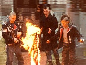English: Punks burning a US flag (early 1980's)